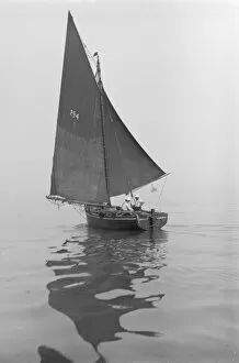 Calm Collection: Fishing Smack under sail, 1911. Creator: Kirk & Sons of Cowes