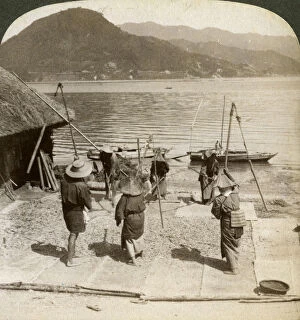 Images Dated 17th July 2008: Flailing barley beside a fishing beach on the Inland Sea, Japan, 1904.Artist: Underwood & Underwood