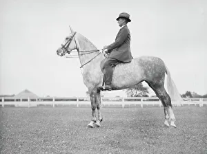On Horseback Prints: Fletcher, Mr. on a horse, 1933 July. Creator: Arnold Genthe