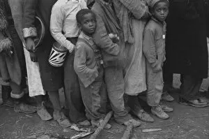 Flood refugees at mealtime, Forrest City, Arkansas, 1937. Creator: Walker Evans