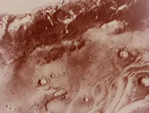 Crater Prints: Fog -filled craters, Mars. Creator: NASA
