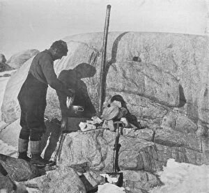 Robert Falcon Collection: Forde Cooking Seal-Fry on the Blubber Stove at Cape Roberts, c1911, (1913). Artist