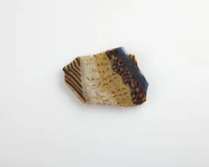 Roman Period Prints: Fragment of an inlay with fish design, Ptolemaic Dynasty to Roman Period, 305 BCE-19 CE
