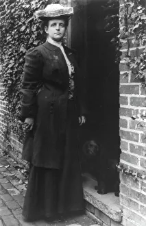 Frances Benjamin Johnston, in doorway with cocker spaniel, n.d.. Creator: Frances Benjamin Johnston