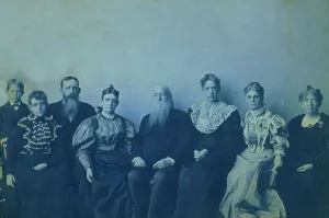 Frances Benjamin Johnston posed with seven members of her family, in her Washington... 1896. Creator: Frances Benjamin Johnston