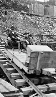 Carpenter Frank G Prints: Frank G. Carpenter and man sitting on tracks, between c1900 and 1924. Creator: Unknown
