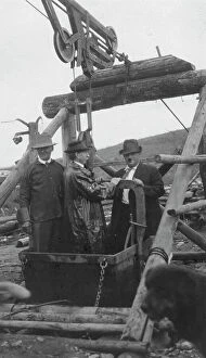 Journalist Collection: Frank G. Carpenter in middle of bucket at gold mine, between c1900 and 1916. Creator: Unknown