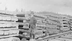 Journalist Collection: Frank G. Carpenter standing by railroad ties, between c1900 and 1916. Creator: Unknown