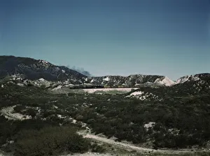 Engine Gallery: Freight train with two helper engines climbing the steep grade of Cajon Pass (westbound), CA. 1943