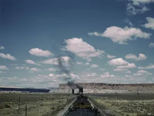 Plateau Prints: A freight train stopping for coal and water at a siding enroute to Gallup