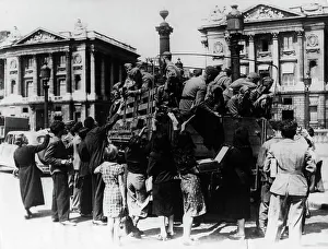 Occupied Prints: French street sellers offering souvenirs to a truckload of German soldiers