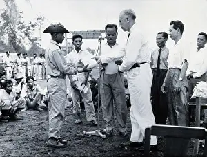 South East Asia Prints: Fritz Ronnefeldt distributing medicine, c1940s. Creator: Unknown