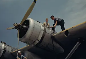 Fueling a plane at the Naval Air Base, Corpus Christi, Texas, 1942. Creator: Howard Hollem