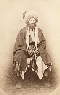 Caucasus Asia Prints: Full-length portrait of man, seated, facing front, between 1870 and 1886. Creator: Unknown