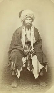 Caucasus Asia Prints: Full-length portrait of man, seated, facing front, between 1870 and 1886. Creator: Unknown