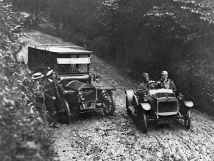 Napier Prints: G. W. K passing Napier on very muddy track circa 1915. Creator: Unknown