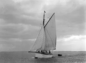 The gaff rig sailboat Bunty close-hauled, 1921. Creator: Kirk & Sons of Cowes