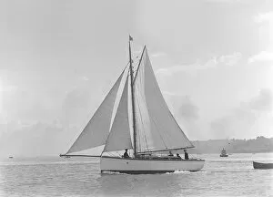 The gaff rig sailboat Bunty close-hauled, 1921. Creator: Kirk & Sons of Cowes