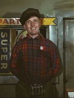 Portrait Photographs Gmgpc Gallery: Garage mechanic near Newark, N.J. Badge denotes member of Office of Defense Transportation, 1943