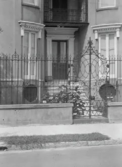 Multi Storey Prints: Gate and doorway of a multi-story house
