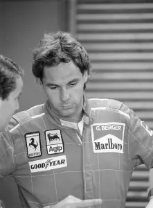 Motor Racing Team Prints: Gehard Berger listening to a member of the Ferrari team, 1988
