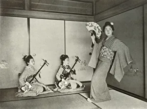 In Lotus Land Japan Prints: A Geisha Dancing, 1910. Creator: Herbert Ponting