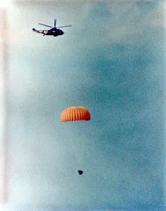 Recovery Prints: Gemini 12 descends for splashdown, 1966. Creator: NASA
