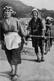 Cheerful Gallery: Three generations of women moving a cart with grandmother at the rear, pushing, c1900, (1921)