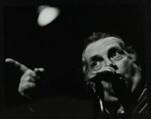 Pointing Collection: George Melly on stage at the Forum Theatre, Hatfield, Hertfordshire, 8 April 1983