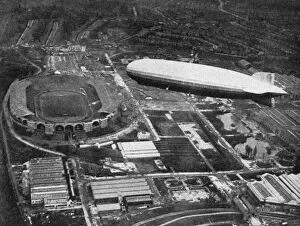 German airship Graf Zeppelin flying over Wembley during the FA Cup Final, London, 1930.Artist: Central Press