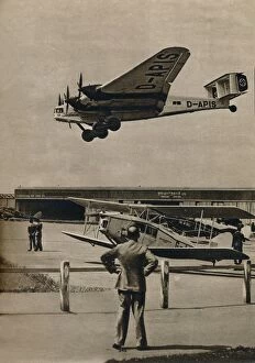Air Travel Gallery: A German Junkers airliner arriving at Croydon Airport, c1934 (c1937)