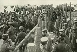 Barbed Wire Gallery: German Prisoners Entering the Cages, (1919). Creator: Unknown