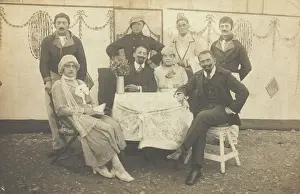 Variety Show Prints: German soldiers, some in drag, pose round a table at a concert party