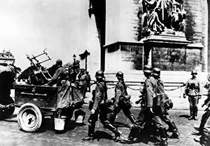 German troops marching past the Arc de Triomphe, Paris, June 1940