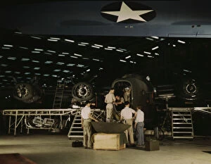 Mechanic Gallery: Getting a nose door ready to put on a C-87...Consolidated Aircraft Corp... Fort Worth, Texas, 1942