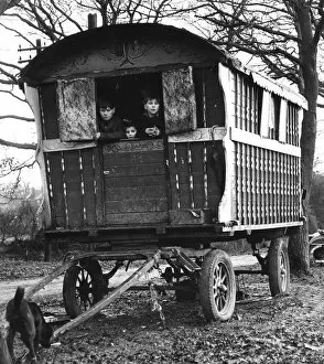 Gipsy children looking out of their caravan by the roadside, Charlwood, Surrey, 1964