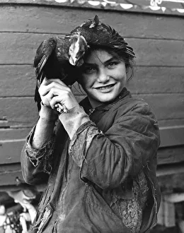 Gipsy girl holding a chicken, 1960s