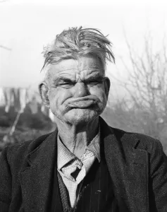 Amusing Gallery: Gipsy pulling a gurney face, Lewes, Sussex, 1964