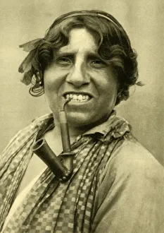 Muller Prints: Gipsy woman smoking a pipe, Burgenland, Austria, c1935. Creator: Unknown