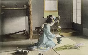 Admiring Gallery: Girl arranging flowers, 1890 s. Creator: Japanese Photographer (19th Century)