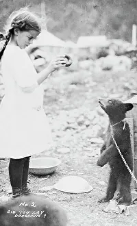 Plaits Prints: Girl and bear cub, between c1900 and 1916. Creator: Unknown
