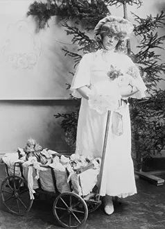 Girl with dolls and doll carriage, 1900. Creator: Unknown