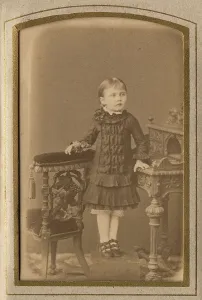 A girl in a dress and shoes, late 19th cent - early 20th cent. Creator: PA Milevskii