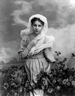 Intensity Prints: Girl and flowers, c1897. Creator: Minnie Libby