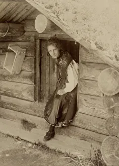 Girl looks out from a doorway, 1890-1920. Creator: Helene Edlund