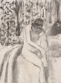 Girl Putting on Her Stockings, 1876-77. Creator: Edgar Degas