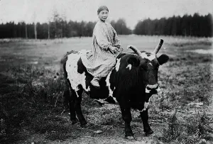 Yakutia Prints: A girl riding a bull, 1890. Creator: Unknown