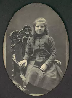 [Girl with Ringlets, Seated, Three-Quarter Length], 1890s. Creator: Frederick Gutekunst