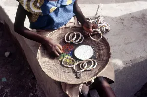 Beads Prints: Girl selling hand-made bracelets, Mali, 1990. Creator: Amanda Waite