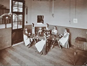Knitting Machine Prints: Girls knitting socks by machine at the Elm Lodge School for Blind Girls, London, 1908